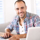 Man working on laptop computer from home